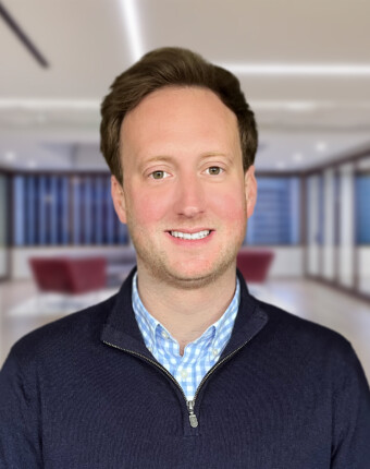 uk-tax-partner-standing-in-office